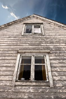 Old haunted house with two dark windows