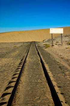 Sand dune that has engulfed a railway line in Namibia