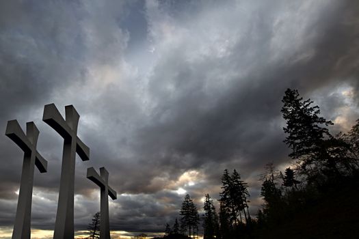 Good Friday Easter Day Crosses with Cloudy Sky and Trees Background