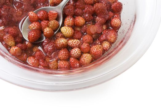 Portion of sweet wild strawberry jam (with clipping path)