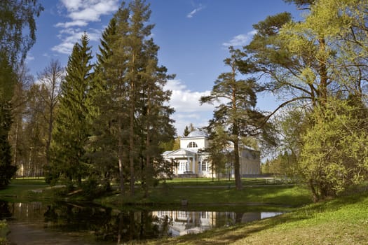 Scenery with classical building and pond in the park