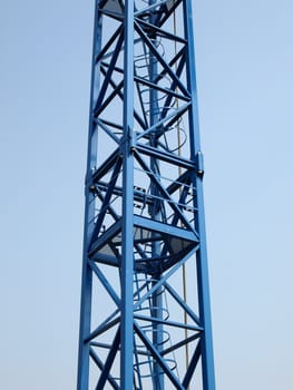 Detail of a tower crane over blue sky