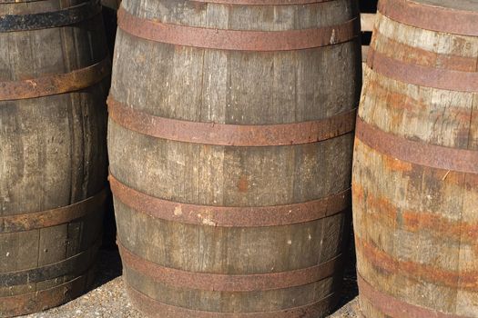 three old barrels used to make alcohol