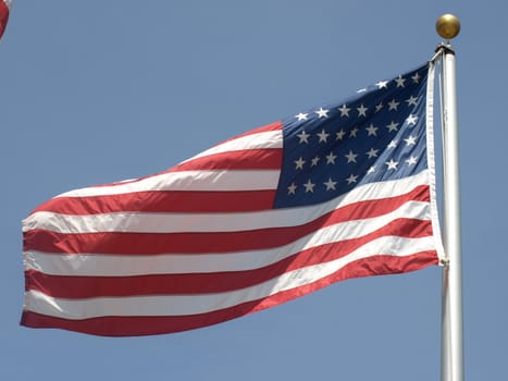 American flag in the breeze during the summer