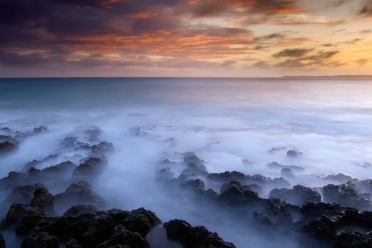 It is sunset of beautiful coral reef coastline.