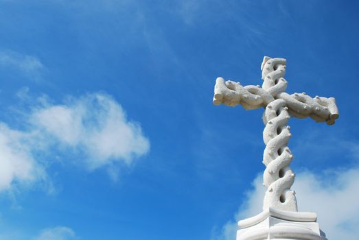 beautiful antique cross with sky background