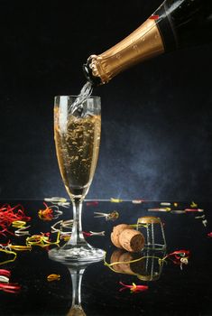 Pouring a champagne flute for celebration time (with confetti) 