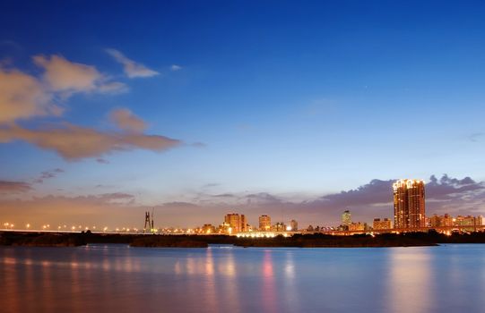 Here is city night scene with the river in Taiwan.