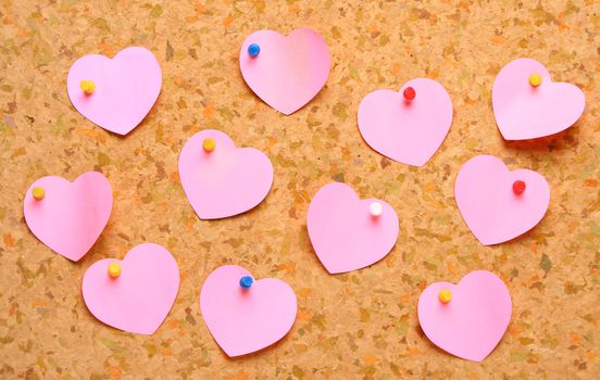 Cork board with heart shape sticky notes