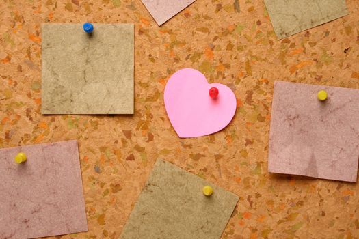 Cork board with heart shape sticky note
