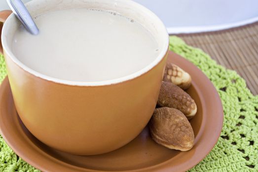 Take a break for huge cup of coffee with milk and treats!