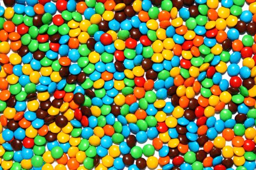 Close up of colored chocolate candies background