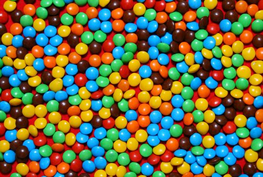 Close up of colored chocolate candies background