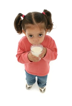 Toddler enjoying a glass of fresh milk