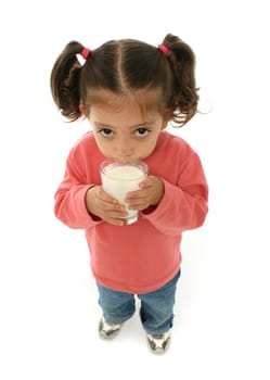 Toddler enjoying a glass of fresh milk