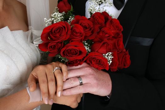 Bridal couple holding hands on their wedding day