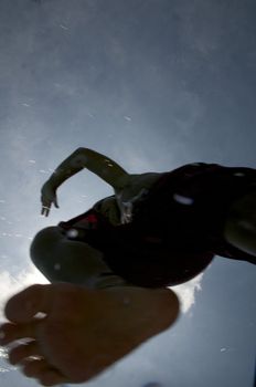 Little boy jumping into pool