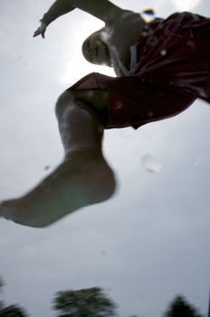 Little boy jumping into pool