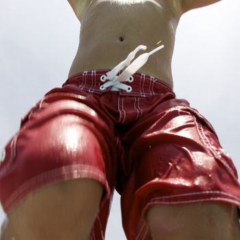 Little boy jumping into pool