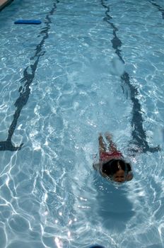 Little boy learning to swim