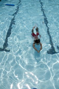 Little boy learning to swim