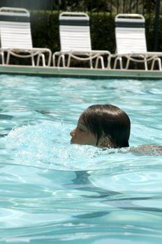 Little boy learning to swim