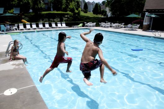 Friends playing at the pool