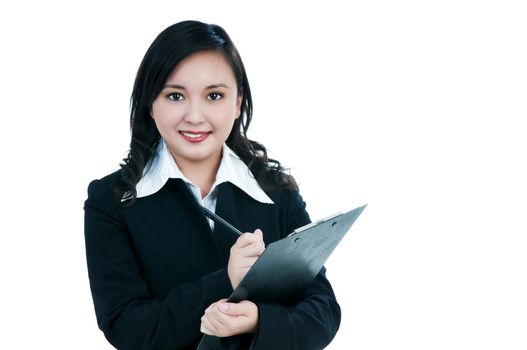 Portrait of an attractive businesswoman writing on clipboard, over white background.