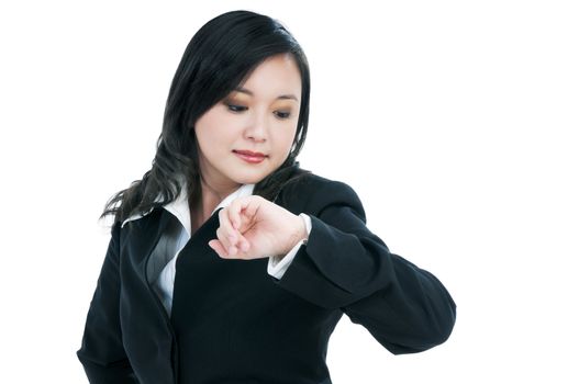 Portrait of a beautiful businesswoman checking time over white background.