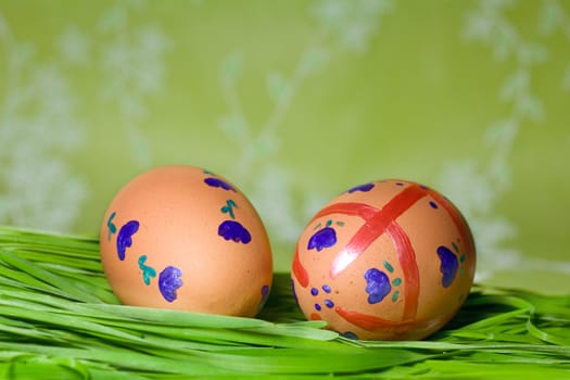Colorful Painted Easter Eggs on green Grass
