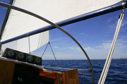 Sailboat sailing blue sea on sunny summer day in Mediterranean