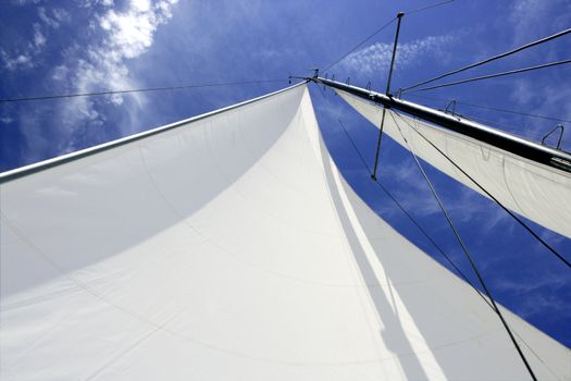 Sailboat sailing blue sea on sunny summer day in Mediterranean