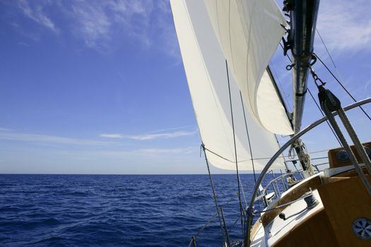 Sailboat sailing blue sea on sunny summer day in Mediterranean