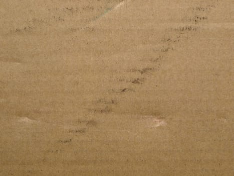 Brown corrugated cardboard sheet useful as a background