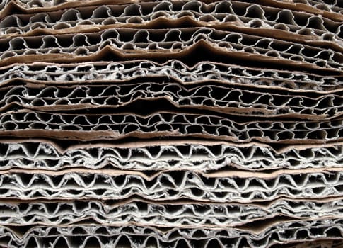 Brown corrugated cardboard sheet useful as a background