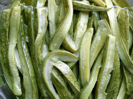 Green courgettes or zucchini vegetables useful as a background