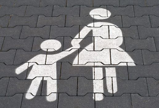 Mother and child parking lot. White sign painted on the pavement.