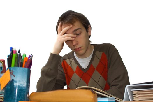 Male student at a table, falling asleep