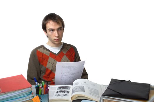 Male student at a table distracted