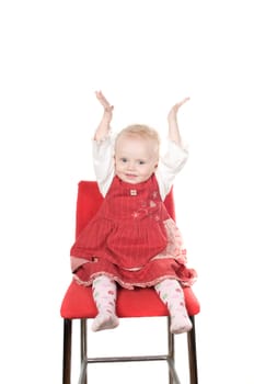 Closeup portrait of little girl sitting on the chair