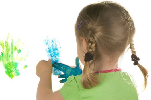 A little girl standing in studio