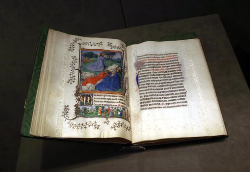 Open pages of ancient medieval illuminated manuscript