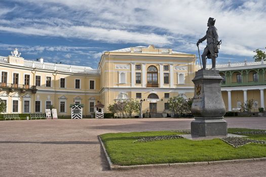 Monument of russian emperor Paul and classical palace in Pavlovsk