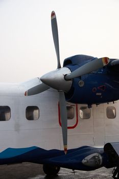 Closeup of small propeller Dornier-228 aircraft used at Kathmandu - Lukla flights in Nepal. It is the popular mean to reach the start point of Everest trek.