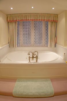 A photo of a bath tub in a bathroom.