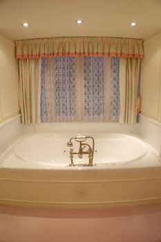 A photo of a bath tub in a bathroom.