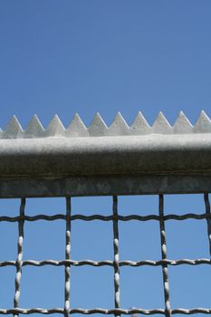 metal fence with with edges and tines