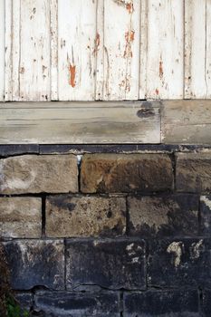 stones and foundation of an old wooden house