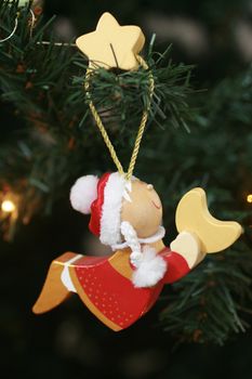 Christmas angel hanging on a Christmas tree