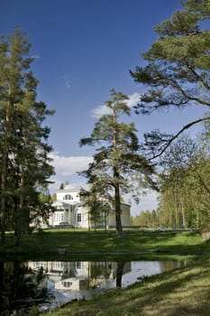 Scenery with classical building and pond in the park